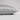A close-up of a pillowcase in light gray silk, showing its smooth texture and hidden zipper detail, set against a neutral light gray background.