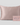A light pink silk pillowcase displayed next to its matching pink ZILK Sleep box on a light gray background. The box features the brand name 'ZILK' in  Charcoal text.