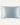 Light blue ZILK silk pillowcase on a cream background